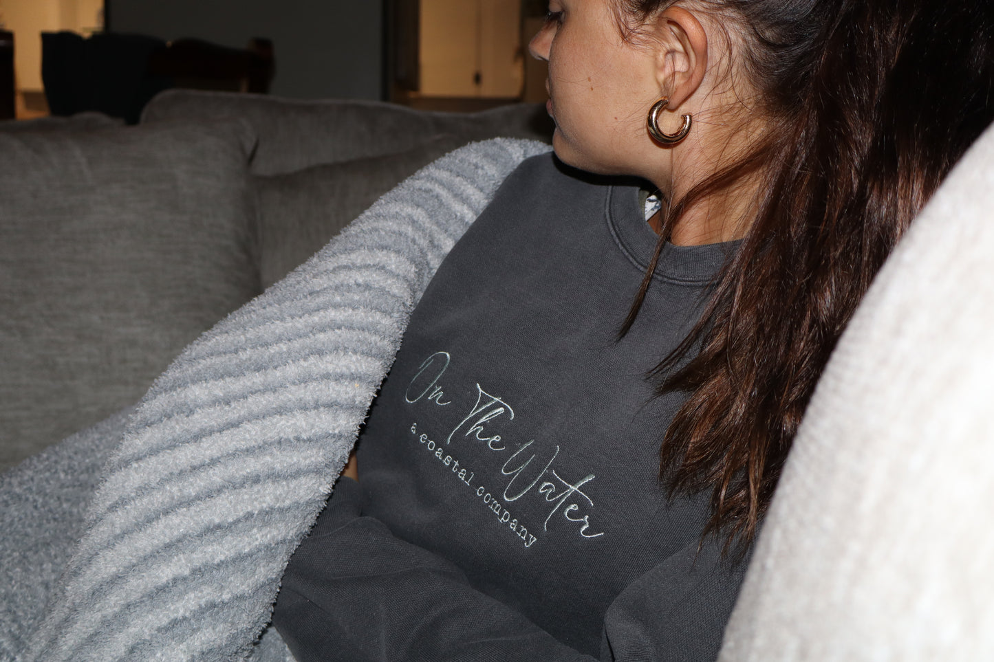 On The Water, a coastal company sweatshirt